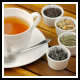 A cup of tea and various tea leaves used for a psychic tea leaf reading at Astrology Boutique in Chicago.