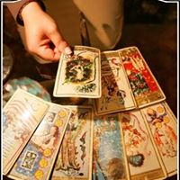 Person giving a psychic tarot card reading at Astrology Boutique in Chicago.